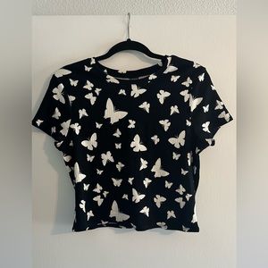 Women’s black crop top with white butterflies